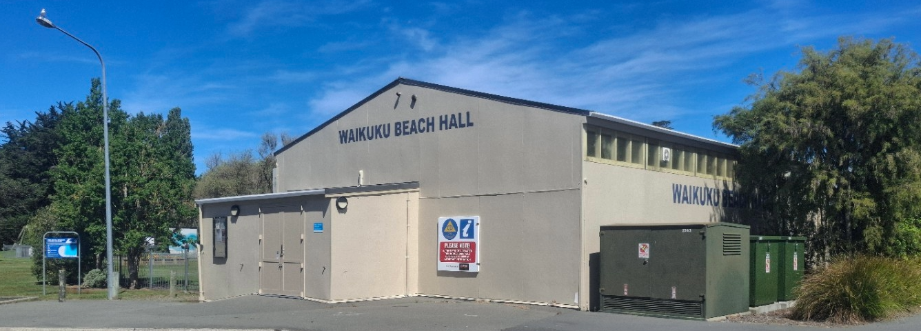 Front of Waikuku Beach Hall, showing its name and entrance